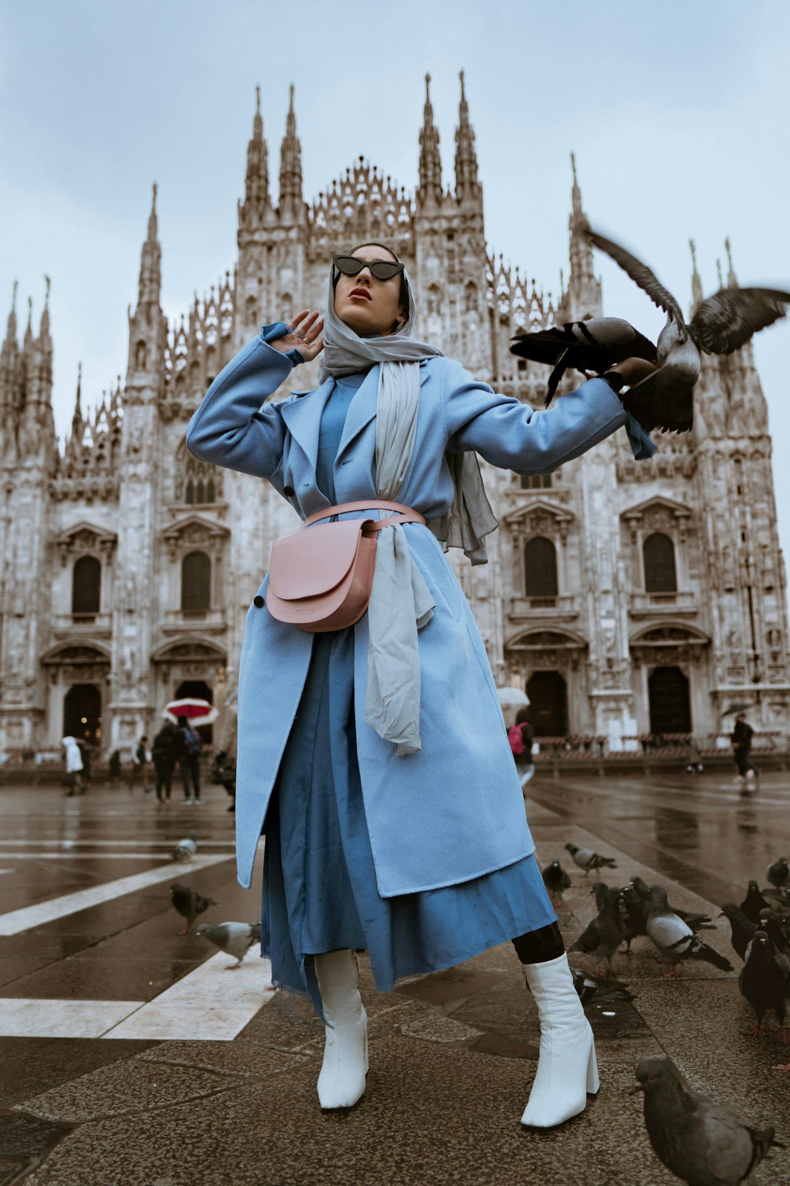 Pale blue coat in front of the Duomo in Milan